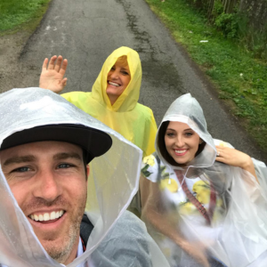 Dr. Andrew Chappell in a raincoat alongside his colleagues in West Jordan.