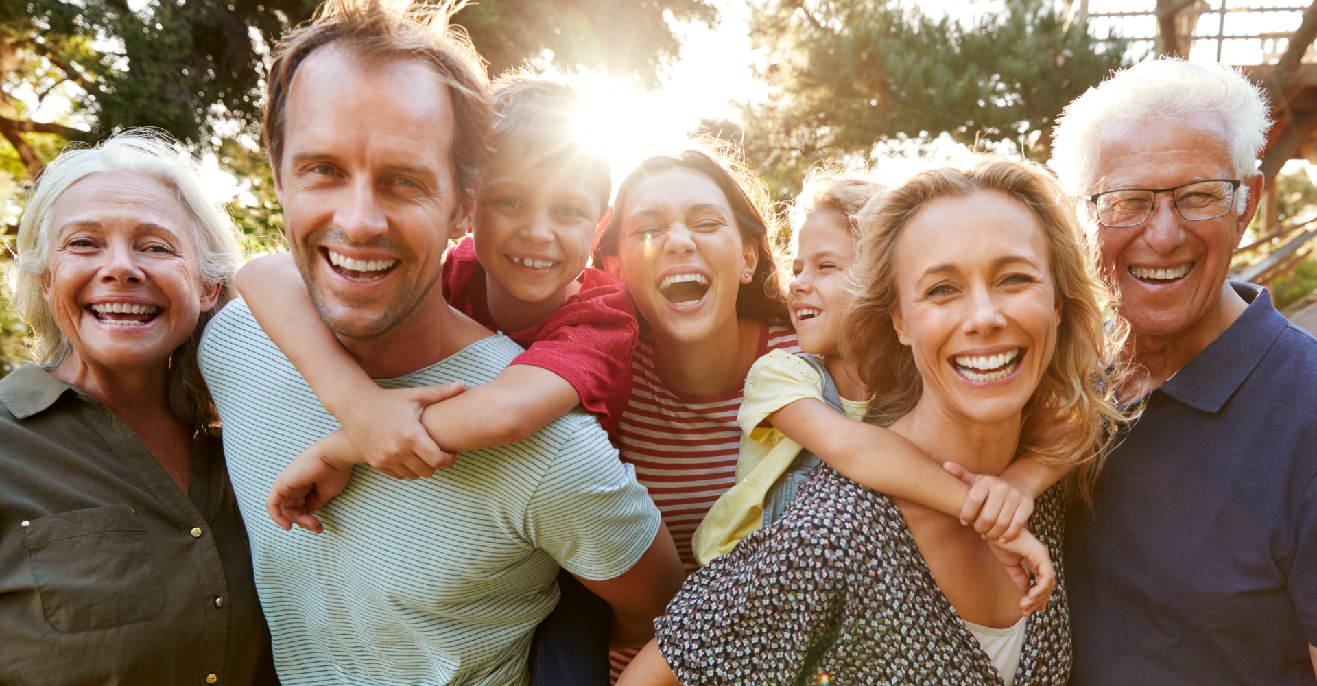 A happy family during a sunny day at Jordan Landing Dental in West Jordan